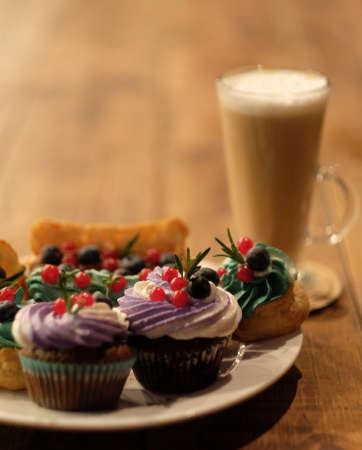 Cakes on a plate and latte, good breakfastの写真素材