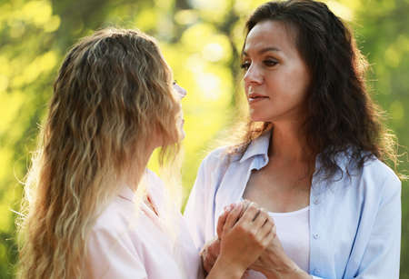 lifestyle, family and people concept - Mother With Adult Daughter In Park Together