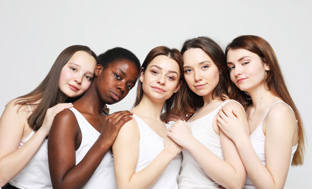 lifestyle, friendship and people concept - group of five girls friends of different nationalitiesの写真素材