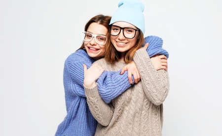 lifestyle, people and friendship concept: Two young female friends standing togetherの写真素材
