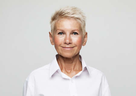 Business, lifestyle and old people concept: Portrait Of Happy Senior Businesswoman