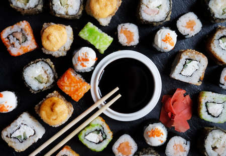 Set of sushi and maki on stone table. Flat lay, top viewの写真素材