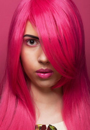 Fashion and beauty concept: Beautiful fashionable model female with pink hair, close up portraitの写真素材