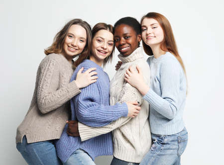 Friendship, feminism and people concept: Portrait of charming multiracial girls wearing casual clothes.の写真素材