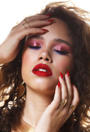 Fashion and beauty concept: attractive african american woman with bright make up