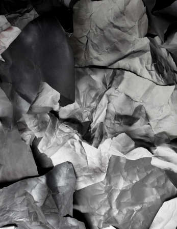 monochrome background of torn pieces of black and white paper