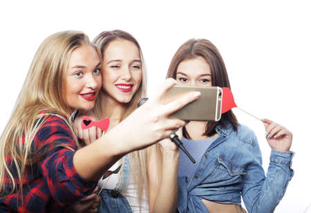 lifestyle, party and people concept: two stylish sexy hipster girls best friends ready for partyの写真素材