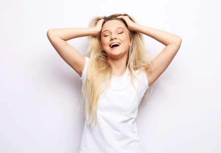 Lifestyle, emotion and people concept: Young cute smiling blond girl