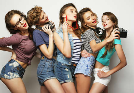 five adorable girls, hipster style, happiness and smiles, the concept of friendship and positive emotions.の写真素材