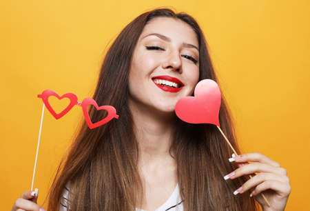 lifestyle, party and people concept: playful young woman ready for partyの写真素材