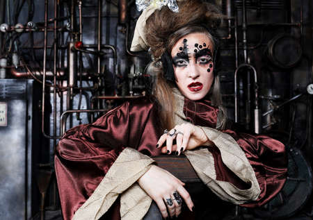 Young woman before a party or carnival. Bright creative makeup and hairstyle.の写真素材