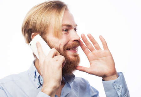 A bearded man listens to the news and shouts in admiration, reports the news.の写真素材