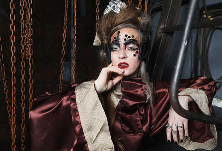 Young woman before a party or carnival. Bright creative makeup and hairstyle.の写真素材