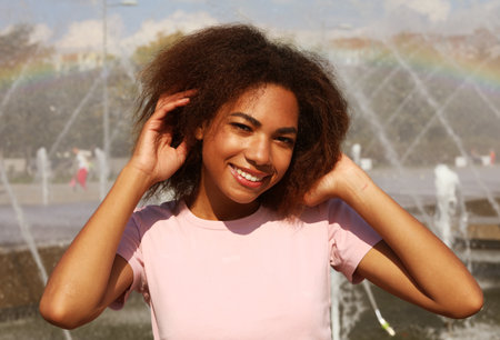 Lifestyle, emotion and people concept: Attractive young African American woman, outdoor, summer...