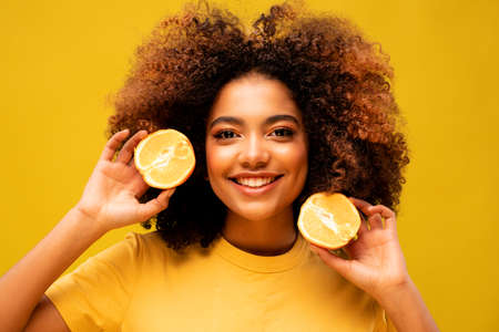 woman afro orange fruit isolated