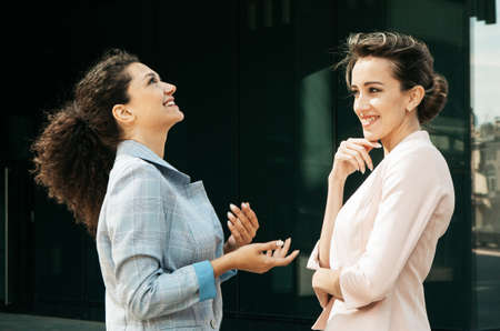 Business, people and lifestyle concept: Two diverse businesswomen.の写真素材