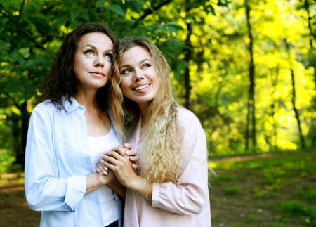 lifestyle, family and people concept - Mother With Adult Daughter In Park Together. love and happy.の写真素材