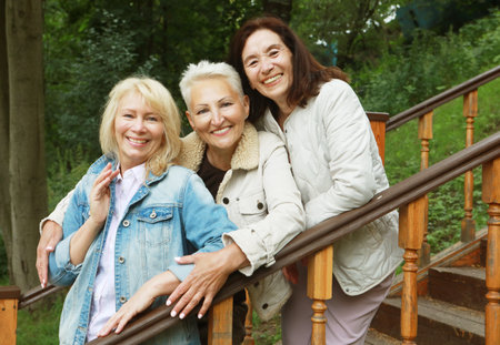 Lifestyle, emotion, old people and gold age concept. Three pensioners, cheerful women friends,...