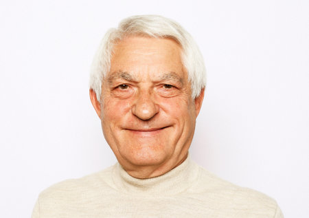 Close up portrait of happy senior man