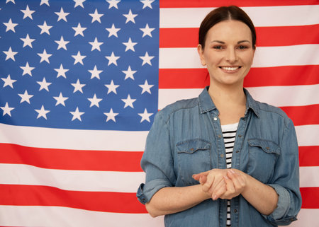 Young english teacher on american flag backgroundの写真素材