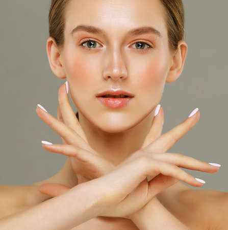 Closeup portrait of a face of the young attractive female with a healthy skin. Beautiful face of young white woman with a clean skin. skincare concept.の写真素材