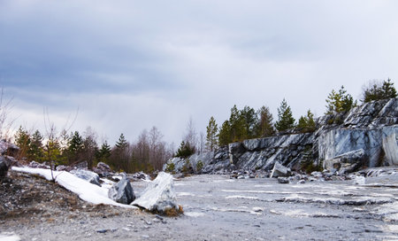 Ruskeala Mountain Park - Landmark of Russia. Marble mountain rock quarry winter landscape, Karelia....