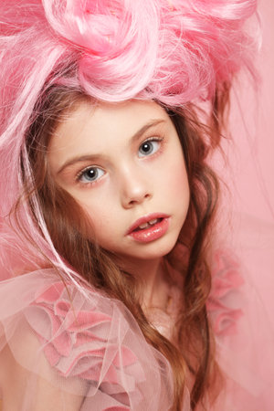 Pretty girl in a pink dress, like a princess, pink hair and makeupの写真素材