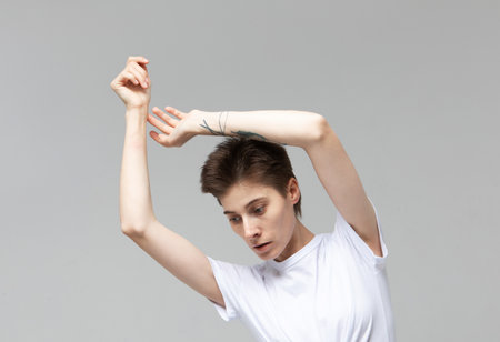 lifestyle, fashion and people concept: young woman with short hair posing in studio.の写真素材