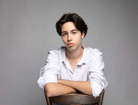 Attractive teenage boy posing in studioの写真素材
