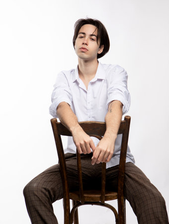 Attractive teenage boy posing in studioの写真素材