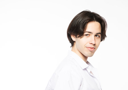 Portrait of a handsome man smiling against white background. Close up picture.の写真素材