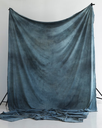 blue studio fabric background on racksの写真素材
