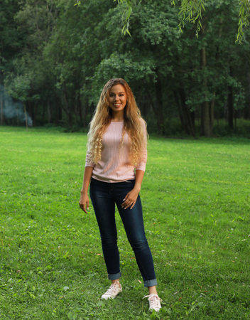 Young beautiful woman in parkの写真素材