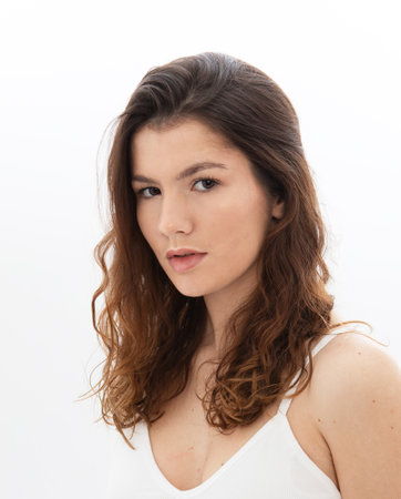 Close up portrait of fashion model with long dark curly hairの写真素材