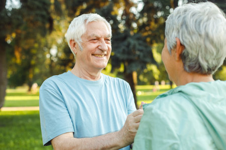 Elderly couple on a summer walk in the park. Close-up portraits. Lifestyle concept.の写真素材