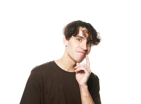 happy smiling man wearing brown t-shirt looking at camera on white background