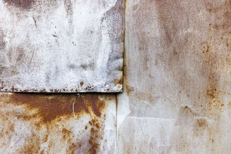 Image of nailed old rusty metal sheets. Wall of old rusty metal sheets. Industrial background. Large...