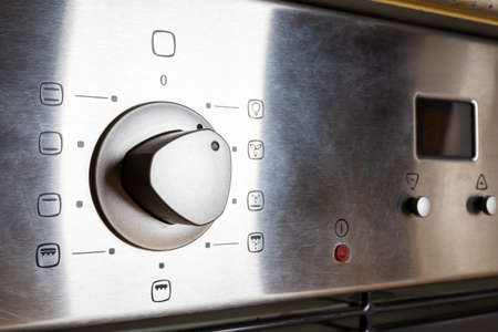 Image of the control panel of a modern electric oven. Buttons for controlling an electric oven. Closeup.の写真素材