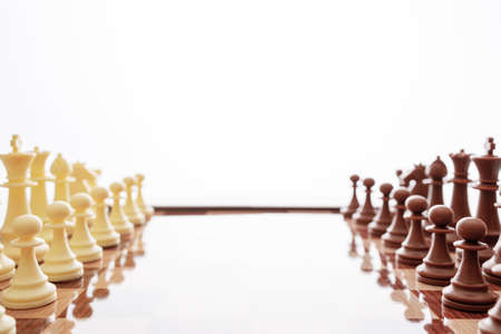 Image of chess pieces on a chessboard. World Chess Day. International Chess Day. July 20. Side view. Closeup. White background. Copy spaceの写真素材