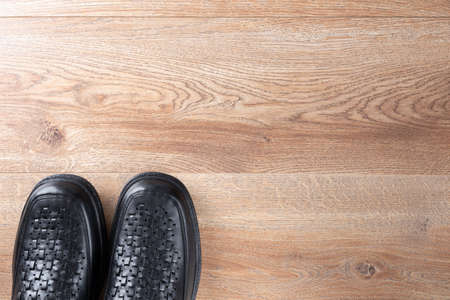 New black men shoes on wooden background. Elastic sided shoes. Side gusset shoes. Lazyman shoes. Top...