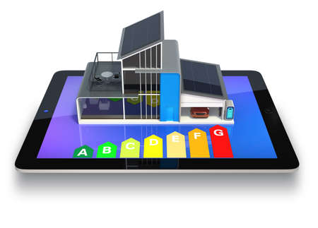 Eco house displaying on tablet screen, show with energy efficiet chart Clipping path available Eco house displaying on tablet screen, show with energy efficiet chart Clipping path available