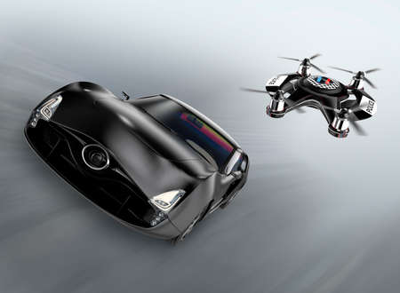 Police drone chasing black car for speed over.の写真素材
