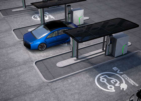 Electric vehicle charging station in public space. The charging spot support by solar panels,...