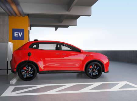 Red electric SUV recharging in parking garage. 3D rendering image. original design.の写真素材