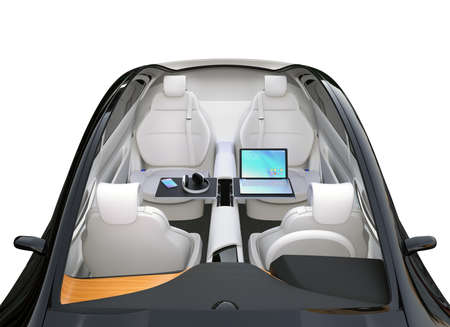 Autonomous car interior. Front seats turned around and laptop PC, smartphone and wireless headphone...