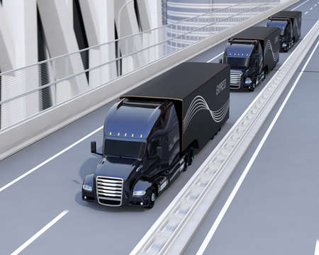 A fleet of black self-driving Fuel Cell Powered American Trucks driving on highway. 3D rendering image.の写真素材