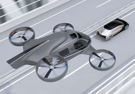 Self-driving Passenger Drone Taxi flying over an autonomous electric car driving on the highway. MaaS concept. 3D rendering image.の写真素材