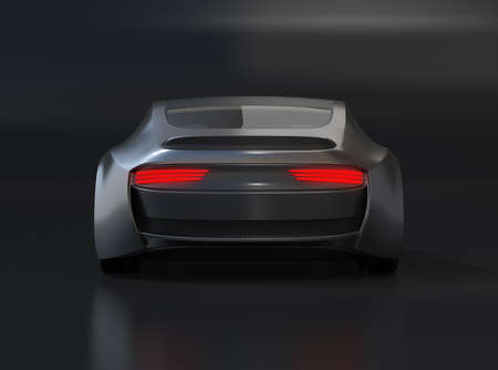 Rear view of black electric sports coupe on black background. 3D rendering image.の写真素材