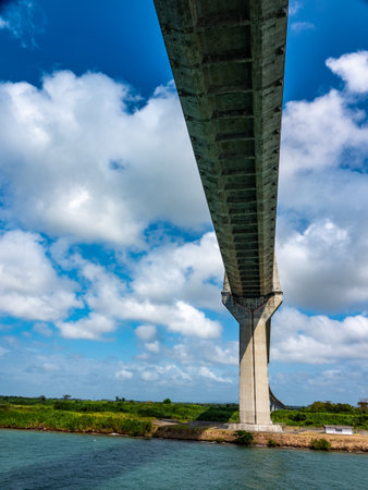 A ship passes under the Atlantic Bridge, a double-pylon, double-plane bridge with a main span of...