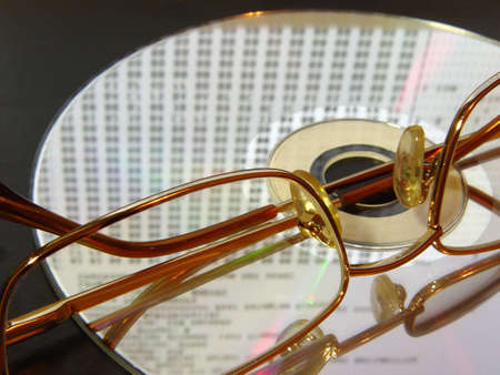 laser disc with laing glasses ad digits reflections